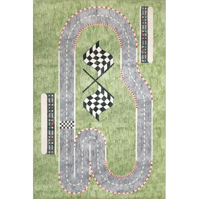 a green rug with a racing track and checkered flags on the floor in front of it