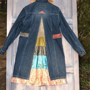 Festival Denim Patchwork Outerwear, Hippie Patchwork Denim Jacket For Fall, Bohemian Winter Denim Jacket With Patchwork, Bohemian Patchwork Denim Jacket For Winter, Bohemian Fall Outerwear With Patches, Hippie Denim Festival Outerwear, Hippie Denim Outerwear For Festivals, Bohemian Winter Outerwear With Patches, Fitted Bohemian Denim Outerwear