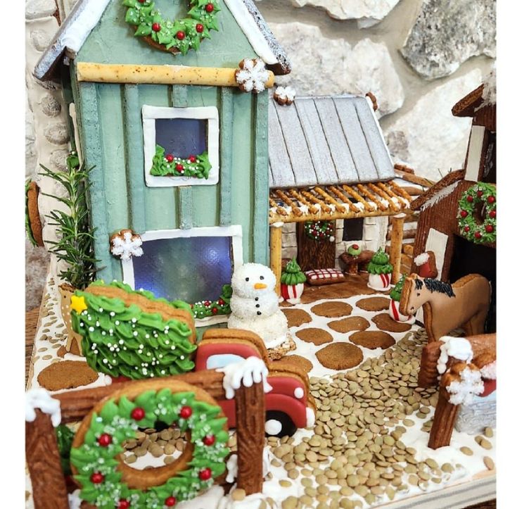 a gingerbread house decorated with christmas decorations