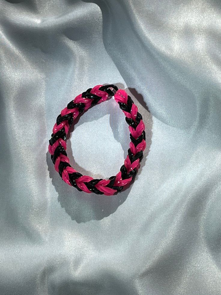 Pink and black rubber band bracelet Hello Kitty Rubber Band Bracelet, Handmade Black Plastic Jewelry, Handmade Black Band Bracelet, Black Plastic Jewelry Gift, Casual Black Band Wristband, Trendy Black Plastic Bracelets, Casual Black Band Wristband Bracelet, Casual Black Wristband Bracelet, Casual Black Handmade Wristband