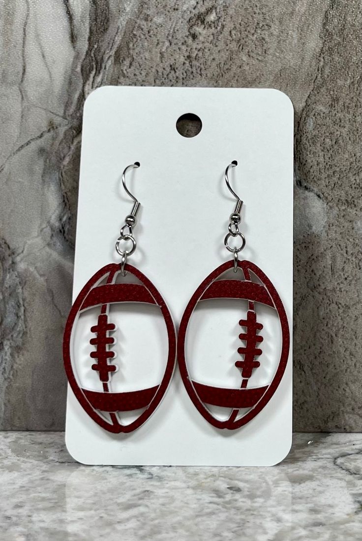 "Earrings measure 2 1/4\" long and have stainless steel hardware. Great accessory for any team! Free shipping." Home Id, Mountain Home, Jewelry Earrings Dangle, Etsy Earrings, Aura, Dangle Drop Earrings, Dangle Earrings, Jewelry Earrings, Football