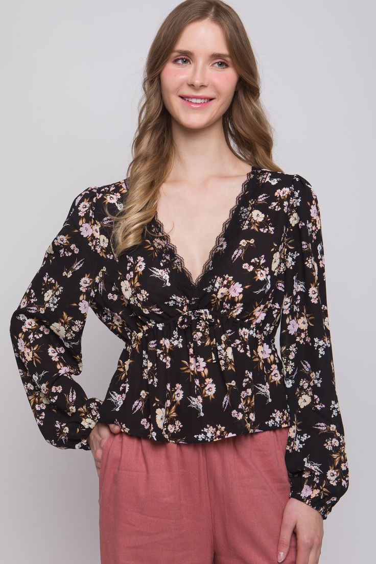 Floral Plunge Long Sleeve V-Neck Blouse 100% Polyester Chic Floral Print V-neck Top, Feminine V-neck Top For Fall, Feminine V-neck Top For Spring, Feminine V-neck Blouse For Brunch, Feminine V-neck Tops For Brunch, Feminine Black V-neck Blouse, Chic V-neck Floral Print Top, Black Surplice Neckline Spring Tops, Black V-neck Top For Brunch