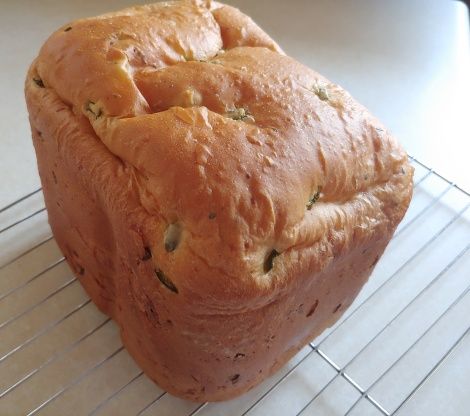 a loaf of bread sitting on top of a cooling rack