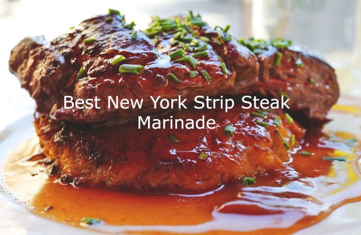 the best new york strip steak marinade is served on a plate with sauce and garnish