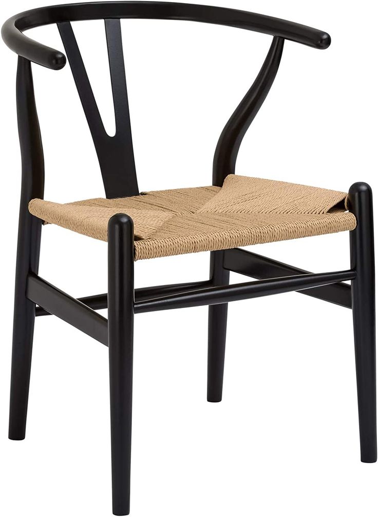 the wish chair is made from black wood and has a woven seat pad on it