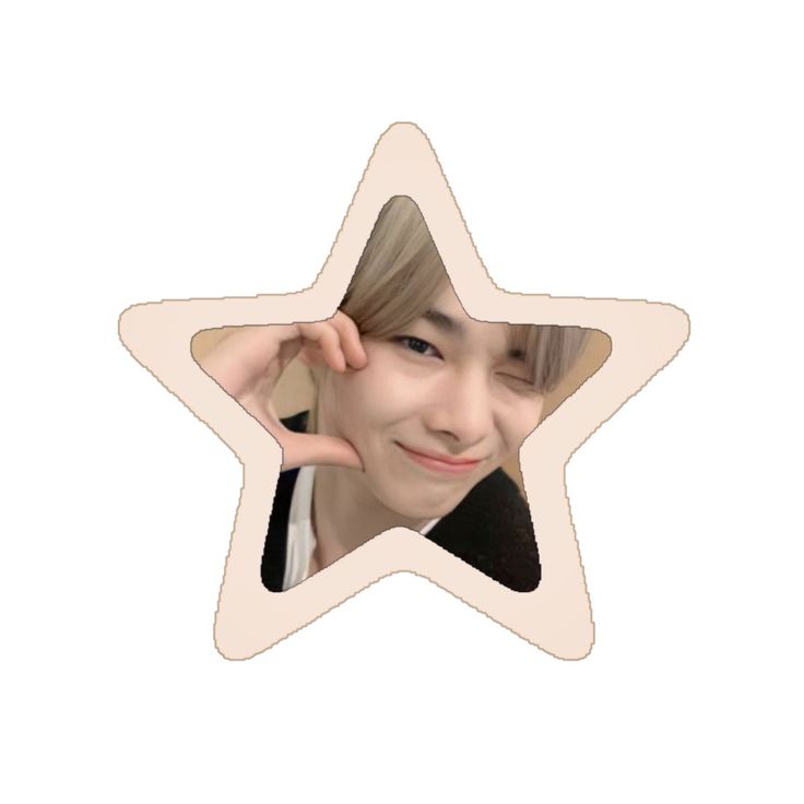 a star shaped cutout with a woman's face and hair in the center