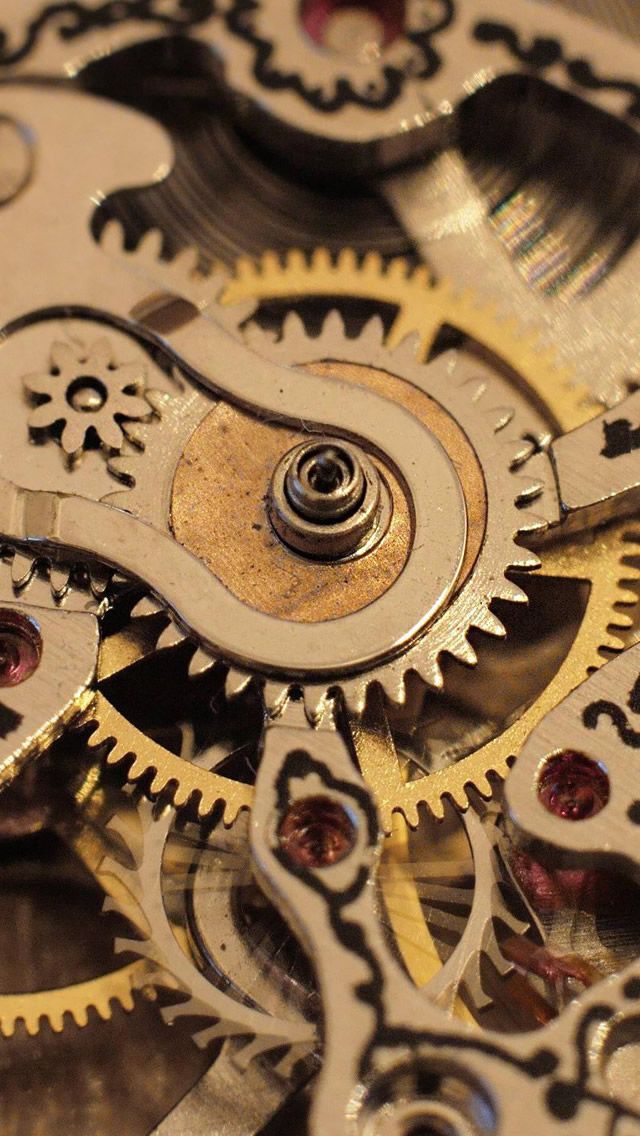 the gears of an old pocket watch