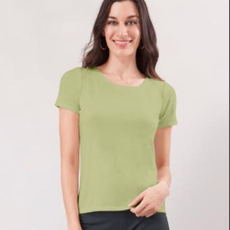 Our Blue Canoe Basics Short Sleeve Is Never Boring. This Tee Is No Exception. Our Silky Soft Bamboo Blend Feels Luxurious Against The Skin, And The Body-Skimming Fit Is Flattering. This Lightweight Fabric Is Very Soft And Has A Beautiful Drape. 28% Organically Grown Cotton/66% Rayon From Organically Grown Bamboo/6% Spandex Made In The Usa High Rounded Neckline Hip Length Body Skimming Fit Latex Free Machine Wash Cool, Low Tumble Dry Green Short Sleeve Plain Top, Green Stretch Plain Tops, Basic Short Sleeve Top For Spring, Green Fitted Top With Scoop Neck, Green Scoop Neck Fitted Top, Green Fitted Scoop Neck Top, Green Fitted Short Sleeve Casual Top, Casual Fitted Green Short Sleeve Top, Fitted Green Short Sleeve Casual Top