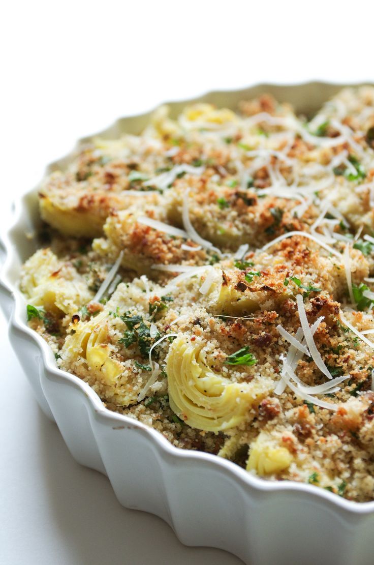 a casserole dish filled with pasta and cheese