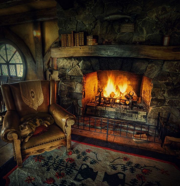 a chair sitting in front of a fire place