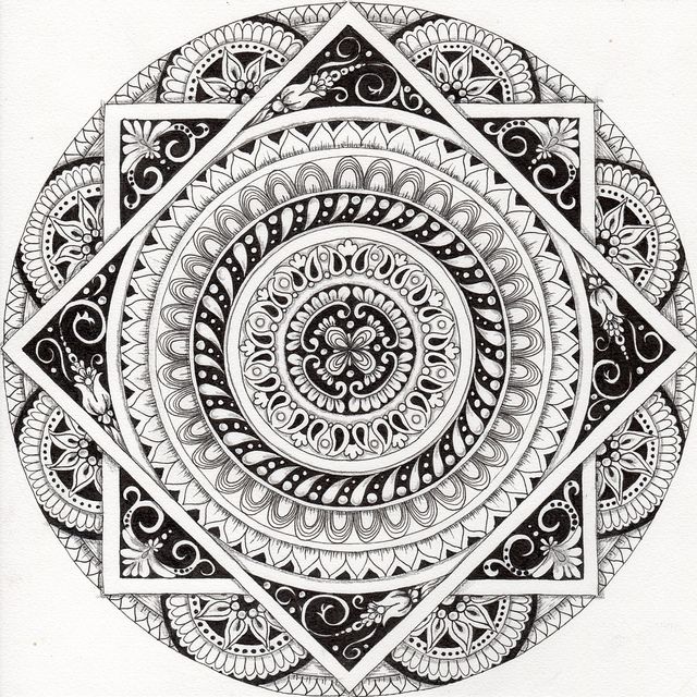 a black and white drawing of a circular design with intricate designs on it's sides