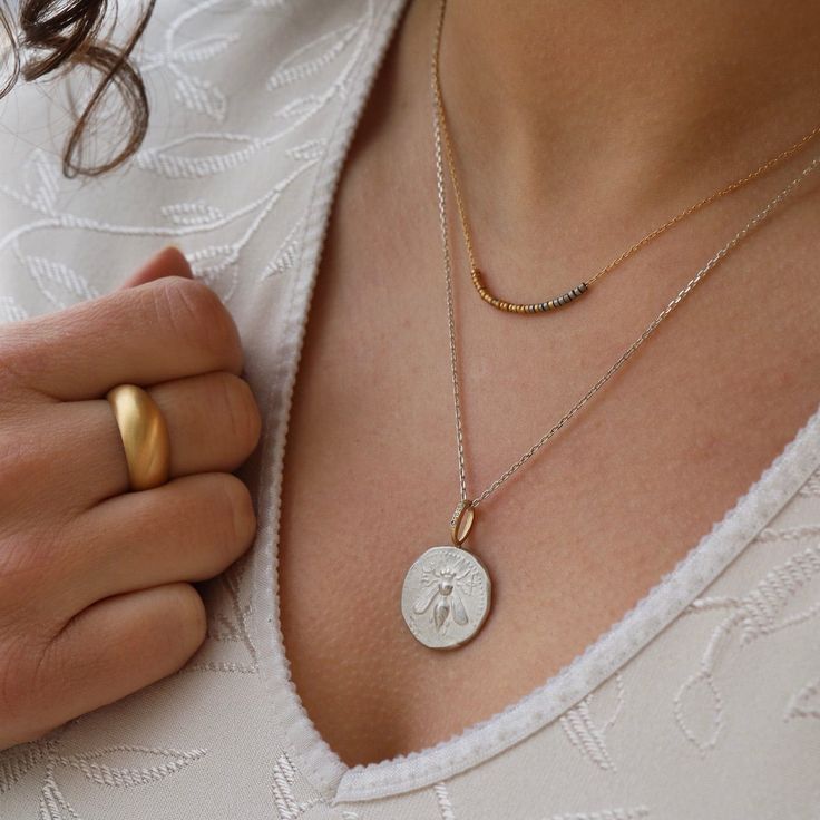 Tiny hand­made beads in a rain­bow of golds, thread­ed along a fine gold chain. Each bead is metic­u­lous­ly craft­ed and the nat­ur­al vari­a­tions in size and shape cre­ate a unique­ness to each necklace. 18K Yellow, Rose, White Gold, 22K, 24k and Platinum 40.5CM/16" 18K Yellow Gold Chain Handmade in the UK By Sia Taylor Minimalist Gold Beaded Necklaces With Tiny Beads, Yellow Gold Necklaces With Tiny Beads For Everyday, Gold Jewelry With Colorful Beads For Everyday, Everyday Gold Jewelry With Colorful Beads, Minimalist Yellow Gold Beaded Jewelry, Minimalist Beaded Yellow Gold Jewelry, Minimalist Gold Beaded Necklace With Colorful Beads, Gold Necklaces With Colorful Beads As Gifts, Minimalist Gold Beaded Necklaces For Jewelry Making