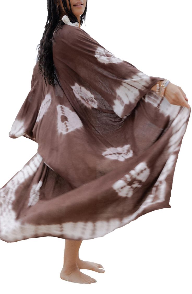 Perfect for poolside hangs or kicking it in the sand, this tie-dye duster is the perfect accessory to add to your sun-loving wardrobe. 57" length (size One Size) Open front Short sleeves 100% viscose Hand wash cold, line dry Imported Model stats: 5'10", 32" bust, 25" waist, 36" hip. Model is wearing size One Size. Long Summer Kimono With Natural Dye, Casual Brown Kimono For The Beach, Casual Summer Kimono With Natural Dye, Casual Tie Dye Kimono For Summer, Long Beach Kimono With Natural Dye, Long Tie Dye Kimono For Vacation, Bohemian Long Duster For Vacation, Long Casual Summer Duster, Casual Long Summer Duster