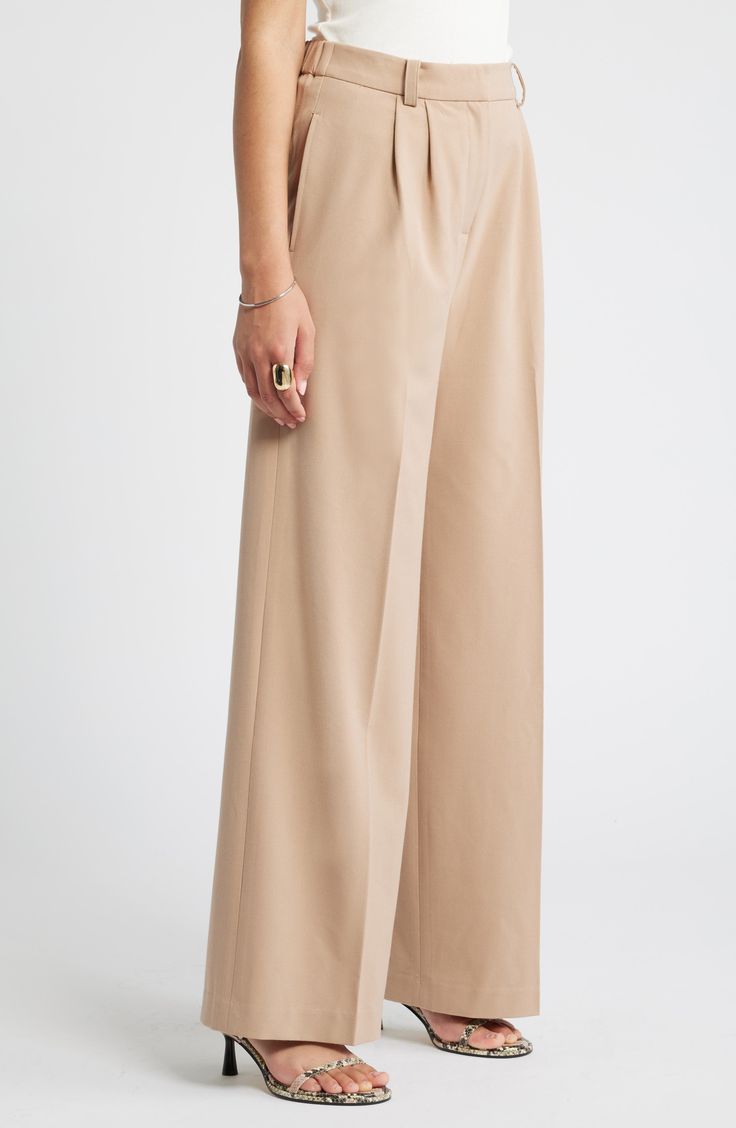 Move from desk days to drinks dates in gracefully draped pants cut from a feel-good fabric. 30" inseam; 24" leg opening; 13" front rise; 16 1/2" back rise (size 8) Zip fly with hook-and-bar closure 62% REPREVE® recycled polyester, 33% rayon, 5% spandex REPREVE recycled polyester is made from 100% post-consumer recycled plastic bottles Machine wash, tumble dry Imported Wide-leg Pants For Daywear In Fall, Beige Wide Leg Full Length Pants For Formal Occasions, Wide-leg Pants For Fall Daywear, Beige Wide Leg Formal Pants, Wide Leg Pants For Fall Daywear, Chic Full-length Beige Bottoms, Beige Formal Wide Leg Pants, Chic Beige Full-length Bottoms, Chic Full Length Beige Bottoms