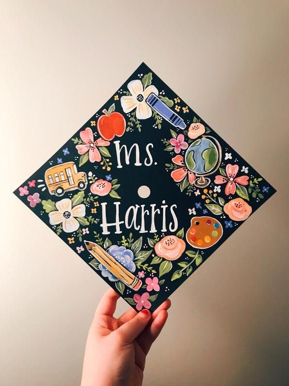 someone holding up a graduation cap with the words ms harris on it