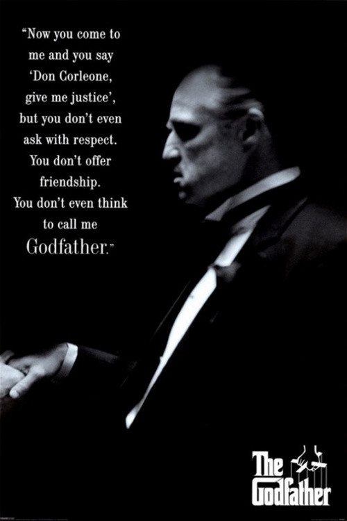 a man in a suit and tie with a quote from the godfather on it