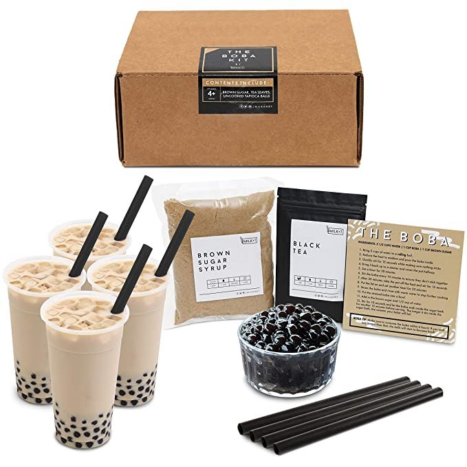 an assortment of drinks and snacks are displayed in front of a cardboard box with black straws