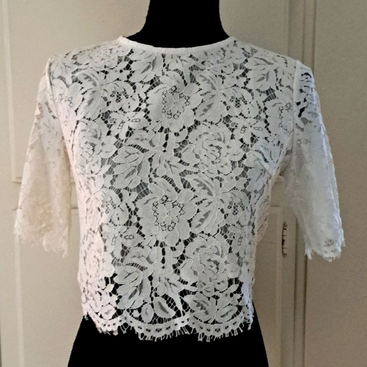 Crop White Lace Blouse/ Top New Without A Tag Never Worn Size: S/M Very Elegant Top, Nice To Wear With Jeans Or Skirt Measurements: Lenght: Approximately 15-16" From Back To Hem. Chest: Approximately 19-19.5" Back Zipper Closure White Crew Neck Crop Top For Party, Fitted Cropped Blouse With Lace Top, Elegant Cropped Blouse With Lace Top, Elegant Fitted Crew Neck Crop Top, Fitted Cropped Lace Top Blouse, Elegant Cropped Lace Top Blouse, Elegant Cropped Lace Blouse, Fitted Lace Top Cropped Blouse, Elegant Short Sleeve Lace Crop Top