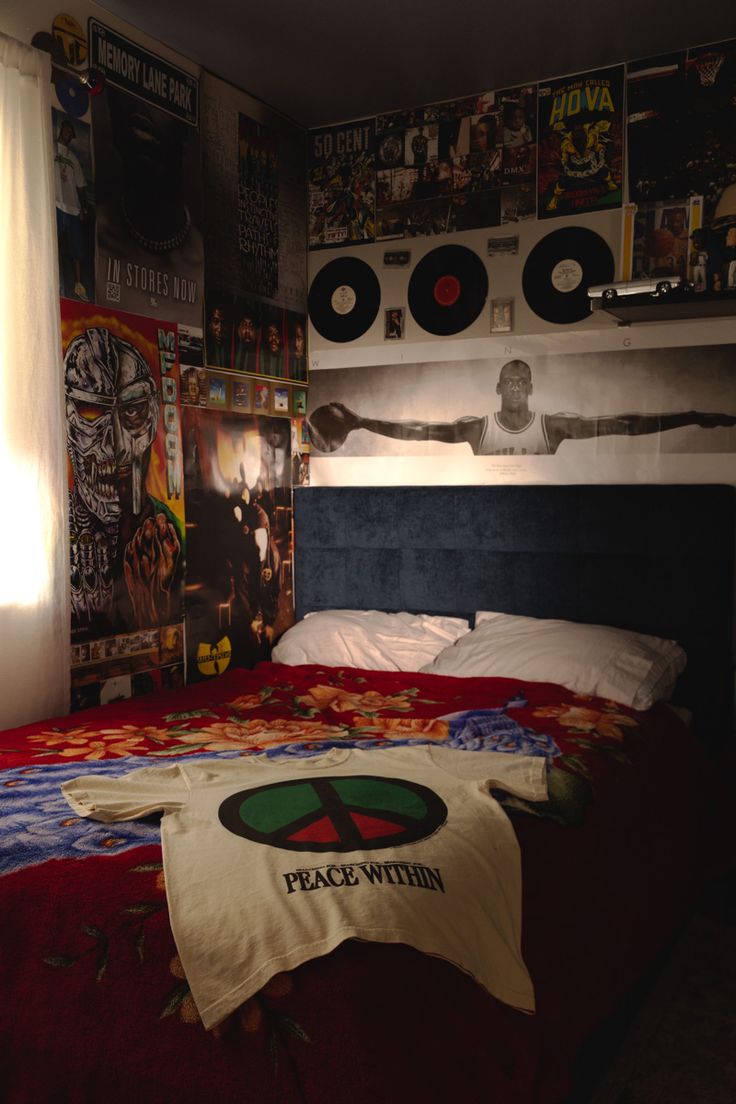 a bed in a room with records on the wall