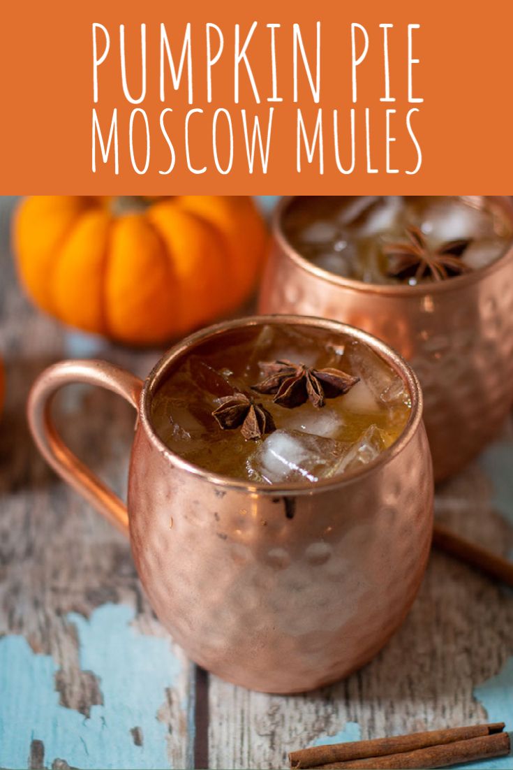 two copper mugs filled with pumpkin spice moscow