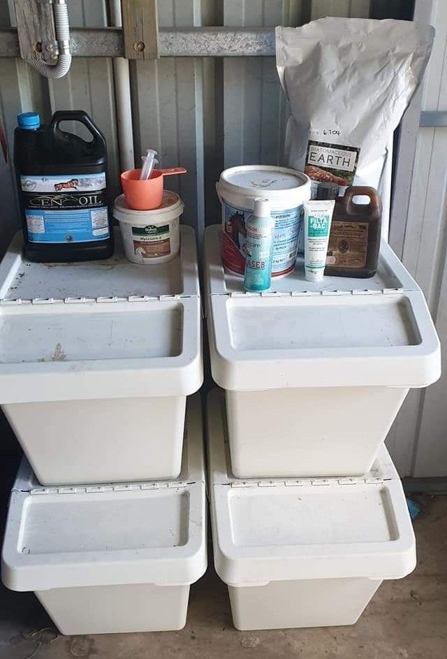 three white containers are stacked on top of each other