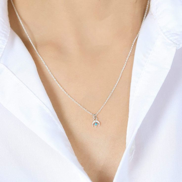 Made with genuine 925 Sterling Silver Nickel-free and lead-free Hypoallergenic and antimicrobial Boma 925 hallmark is located on the boma tag near the necklace clasp. Code : NA 9161TQ Dimensions: approx.1/8" depth x 1/4" width x 3/8" height Chain Length : adjusts from 16"to 18" Features Turquoise Stone representing protection, wisdom, and peace. These associations have been present in various cultures throughout history, and the stone continues to be valued for its diverse symbolism and perceive Blue Round Pendant Necklace For May Birthstone, Blue May Birthstone Round Pendant Necklace, Silver Necklace For Everyday With May Birthstone, Sterling Silver Charm Necklace With May Birthstone For Everyday, Sterling Silver Hypoallergenic Charm Necklace, Minimalist Silver Charm Necklace With Emerald, Hypoallergenic Sterling Silver Round Charm Necklace, Hypoallergenic Sterling Silver Charm Necklaces, Hypoallergenic Sterling Silver Charm Necklace