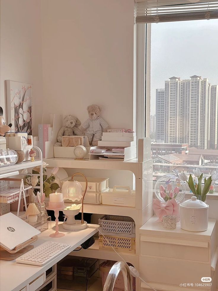 a room with a desk, chair and shelves filled with stuff in front of a window