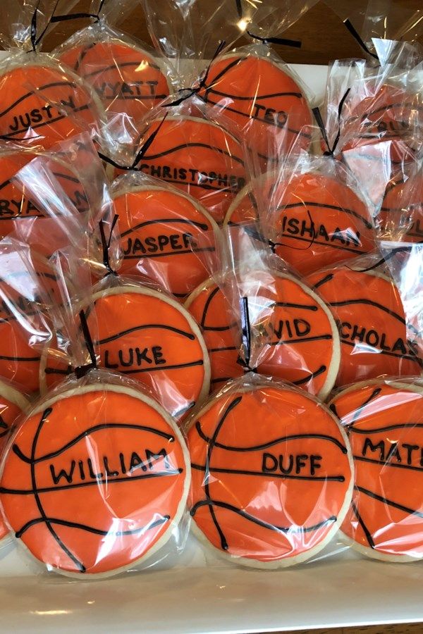 basketball cookies wrapped in plastic wrappers with words on them