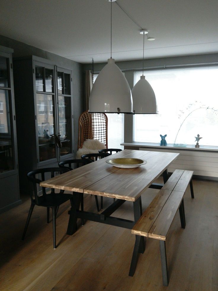 a wooden table sitting in the middle of a room