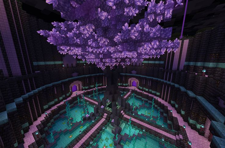 a purple tree is in the middle of a room with lots of lights on it