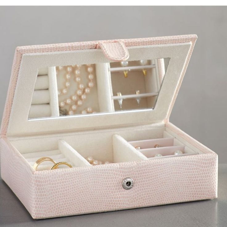 an open jewelry box on a table