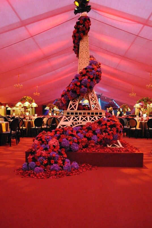 the eiffel tower is surrounded by flowers