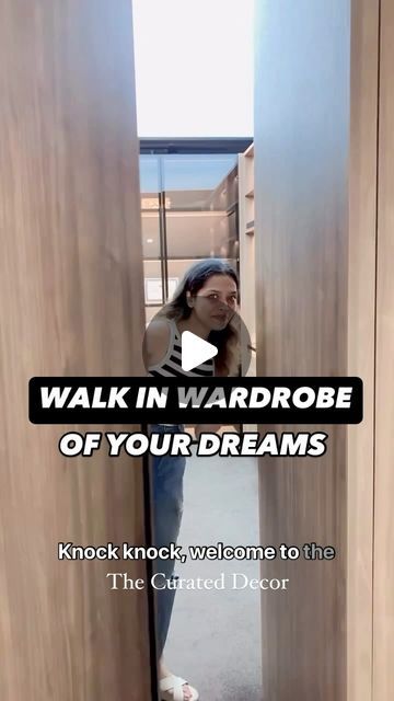 a woman standing in an open doorway talking on her cell phone with the caption walk in wardrobe of your dreams