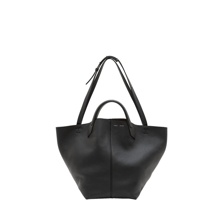 Proenza Schouler "PS1" tote bag in grained leather  Flat top handles  Adjustable shoulder straps Can be worn as a top handle or shoulder bag  Open top with self-tie closure  Approx. 11.8"H x 18.5"W x 9.8"D Leather method dry cleaning Made in Italy Calf Leather Tote Shoulder Bag With Handles, Luxury Bucket Shoulder Bag With Rolled Handles, Timeless Double Handle Bucket Bag With Leather Handles, Modern Calf Leather Shoulder Bag With Handles, Modern Calf Leather Shoulder Bag, Calf Leather Shoulder Bag With Handles For Work, Leather Satchel With Rolled Handles For Evening, Elegant Workwear Bags With Rolled Handles, Classic Calf Leather Shoulder Bag With Rolled Handles