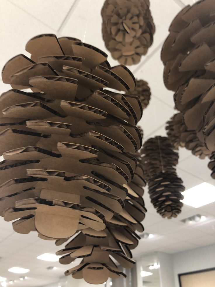 some brown paper decorations hanging from the ceiling