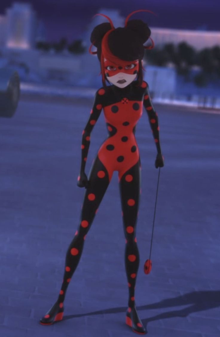 a woman dressed in black and red with polka dots on her body