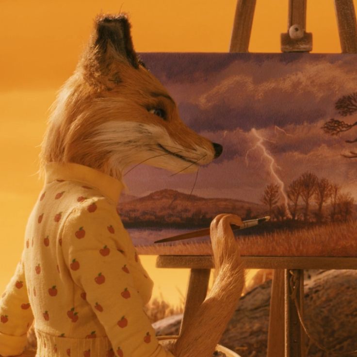 a fox is standing in front of an easel with a painting on it's side