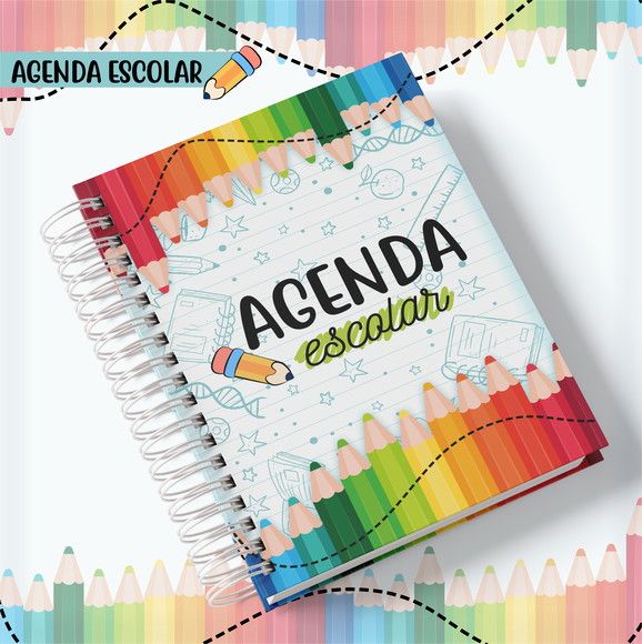 an open notebook with colored pencils on it