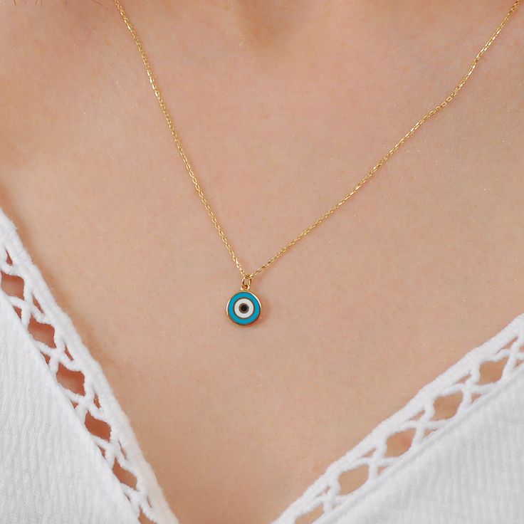 Learn to get in touch with the silence within and know that everything in this life has a purpose. Our powerful evil eye necklace is exquisitely designed to help clear your mind and give you extraordinary clarity of mind. Ward off negative spiritual chants aimed toward you with the powerful Evil Eye symbol. This evil eye necklace made of 14K Solid Gold. PRODUCT DETAILS: 𝐌𝐚𝐭𝐞𝐫𝐢𝐚𝐥: 14K Solid Gold (real solid gold, no gold-filled or no gold plated material) Choice of Gold Color: Yellow Gold Turquoise Evil Eye Round Pendant Jewelry, Turquoise Round Evil Eye Jewelry, Turquoise Evil Eye Round Jewelry, Turquoise Evil Eye Amulet Jewelry, Turquoise Evil Eye Jewelry Gift, Turquoise Evil Eye Amulet Necklace, Spiritual Chants, Eye Symbol, Solid Gold Necklace