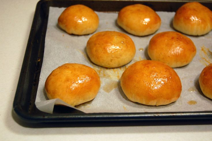 nine rolls on a baking sheet ready to be baked