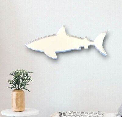 there is a shark shaped wall decoration on the wall