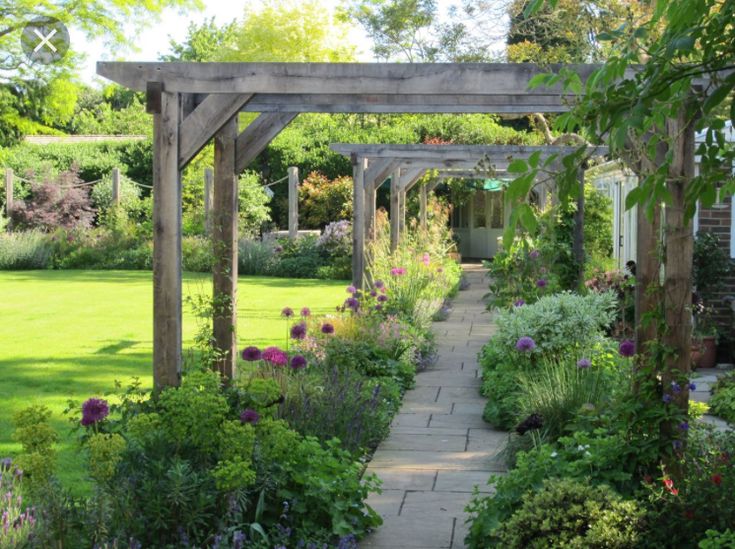 a garden with lots of flowers and trees