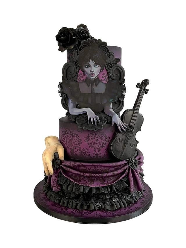 a cake with a violin on top and a woman's face next to it