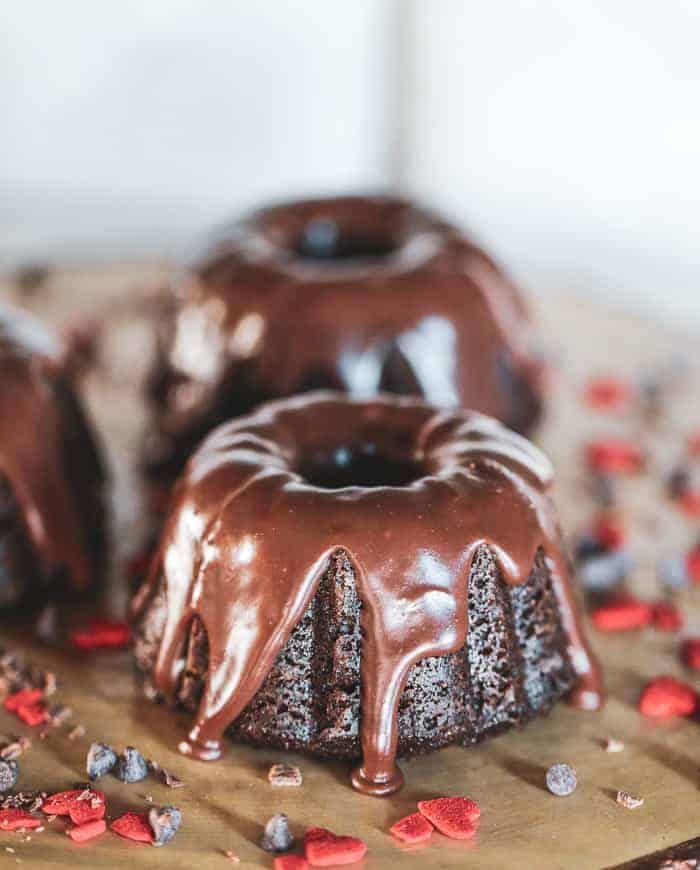 three chocolate bundt cakes sitting on top of a table