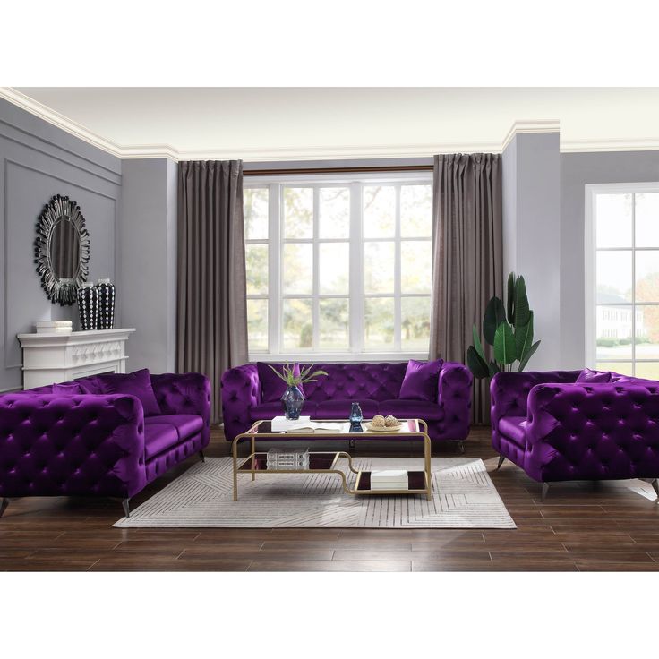 a living room filled with purple couches and chairs