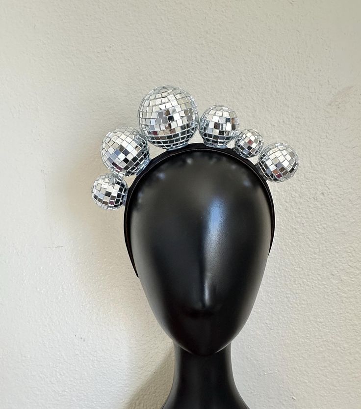 Asymmetric Disco Ball Dancing Queen Crown LISTING SPECS: - 6 multi-size disco balls -1-inch satin wrapped headband base for superior comfort - Handmade to order **Looking for something a little different? more butterfly headbands, crowns, and masks: https://www.etsy.com/shop/muliebritymade/?etsrc=sdt&fbclid=PAZXh0bgNhZW0CMTEAAaa3192460EBjq5Xe7E0emwuISXuAWC2-XGuEA8z7Qp6nJ0zK3Fe9rNO92U_aem_z1YZ1pKXQmJ8V0bMqQuCAQ&load_webview=1&bid=M7oMYbcYYkrebKTpX19upSW4nBTV§ion_id=33299170 colorful home decor: h Trendy Party Headband, Trendy Adjustable Hair Accessories For Party, Trendy Summer Party Headband, Adjustable Silver Headpiece For Carnival, Trendy Party Hair Accessories With Matching Headband, Silver Adjustable Headpieces For Carnival, Fun Adjustable Party Headpieces, Fun Summer Party Headpiece, Silver Headband For Party