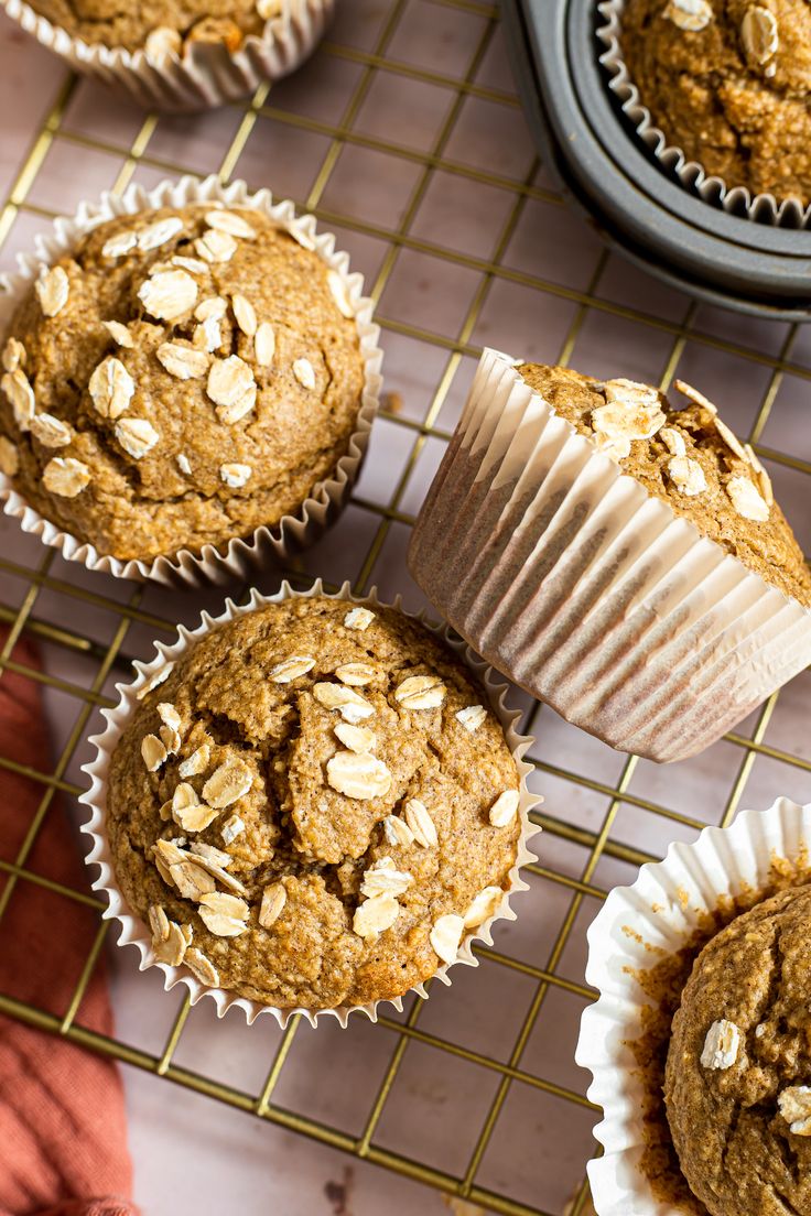 muffins cooling on a wire rack with other muffins in the background