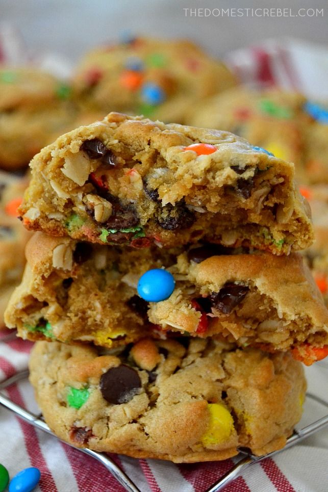 two cookies stacked on top of each other with m & m candies in the middle