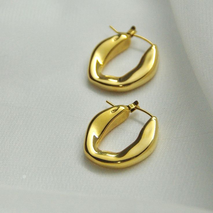 Unique U Hoop Earrings14K Gold Plated Stainless SteelOur U Hoops are the perfect marriage of elegance and charm and will make a delightful addition to any jewelry collection. This lightweight accessory is minimalist in make, yet timeless in style. The trendy pair is made with 14K Gold Plated Stainless Steel allowing its color to remain over time.All of our products are lightweight and made with hypoallergenic materials to allow for comfortable, all day wear.The U Hoop Earrings are the perfect gi Simple Design 14k Gold Earrings, Minimalist 14k Gold Hoop Earrings With Shiny Finish, Gold Minimalist Hoop Earrings For Anniversary, Minimalist Gold Hoop Earrings For Anniversary, Modern Tarnish-resistant Hoop Earrings For Wedding, Gold Plated Polished Hoop Earrings Gift, Minimalist Hoop Earrings With Shiny Finish As Gift, Minimalist 14k Gold Filled Hoop Earrings For Formal Occasions, Minimalist 14k Gold Filled Earrings With Polished Finish