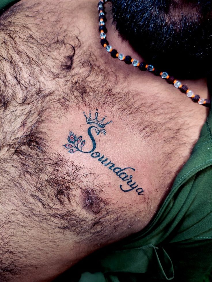 a man with a crown tattoo on his chest